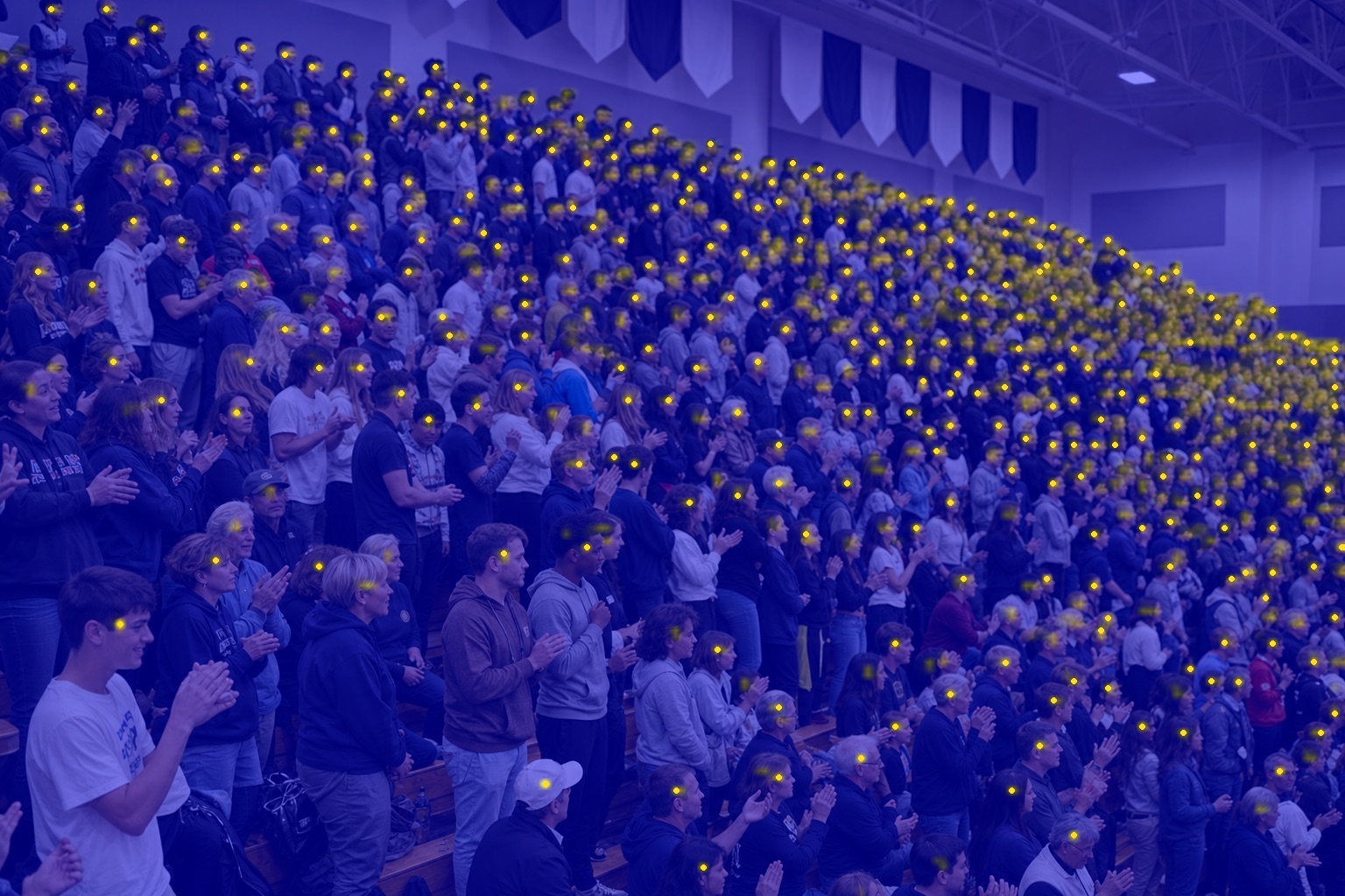 Crowd Counter detection map marking every person in packed gym bleachers